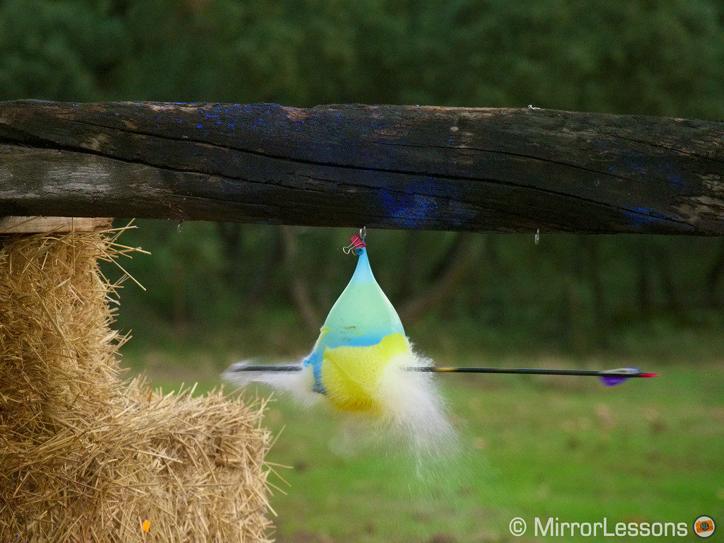 An arrow bursting a water balloon taken using the Pro Capture mode