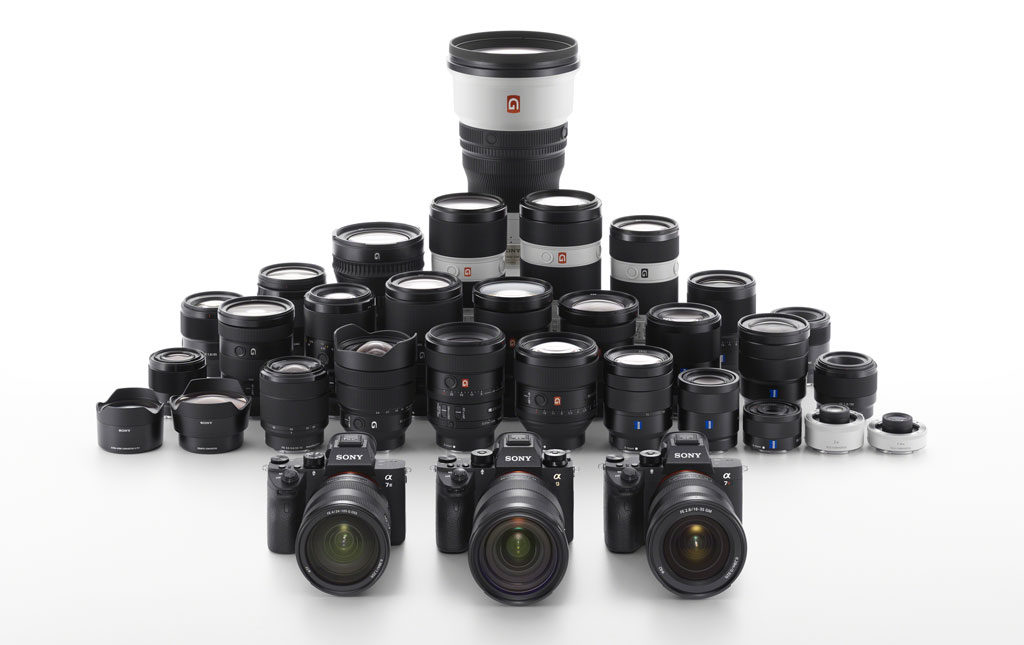 Various Sony FE lenses on white background