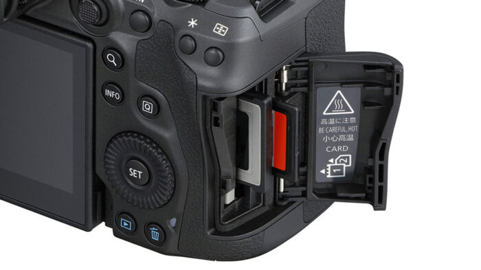 close-up on the Canon R5 memory card slots, with one SD and one CFexpress card inserted