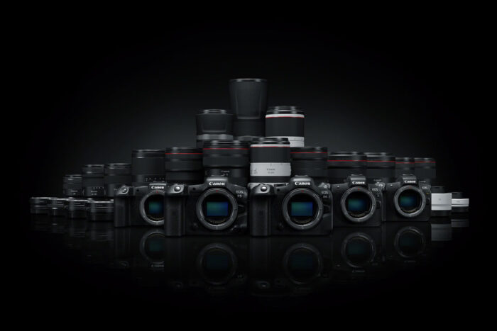 Selection of Canon EOS R cameras and RF lenses on dark background
