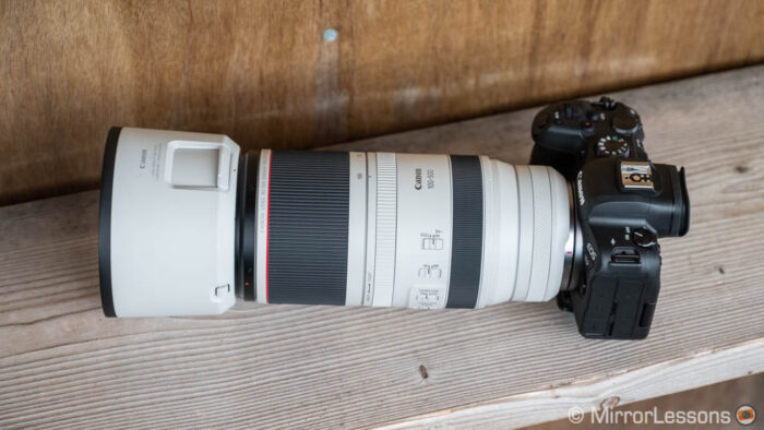 Canon Eos r6 with 100-500mm attached, sitting on a wooden bench