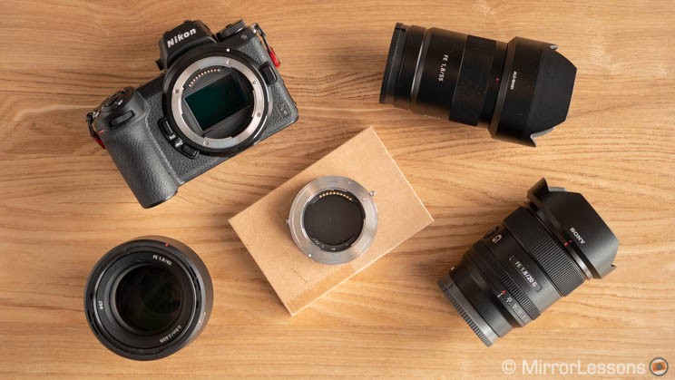 Nikon Z6, three Sony FE lenses and Techart adapter on a wooden background
