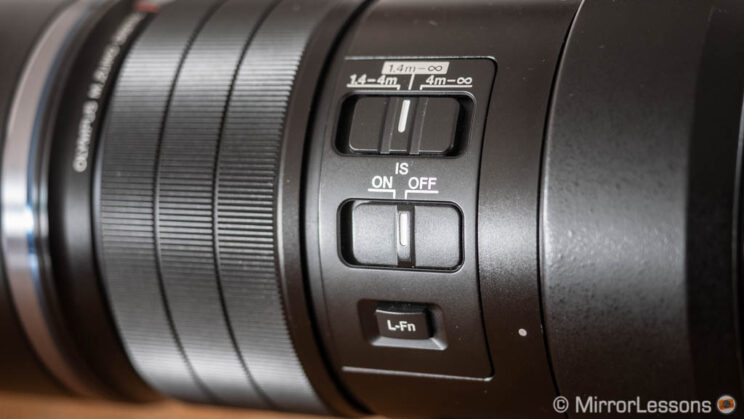 close-up on the button and switches of the Olympus 300mm Pro