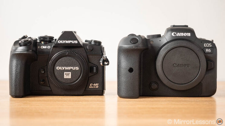 Olympus OM-D E-M1 III next to the Canon Eos R6, front view
