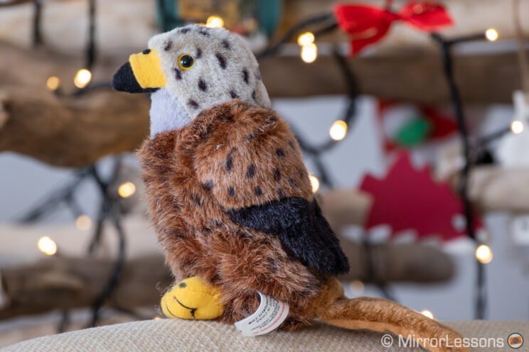 red kite stuffed toy in front of Christmas lights