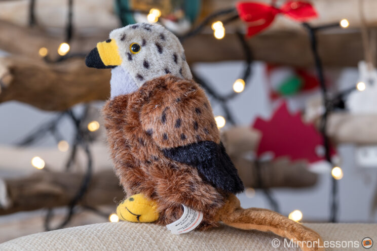 red kite stuffed toy in front of Christmas lights
