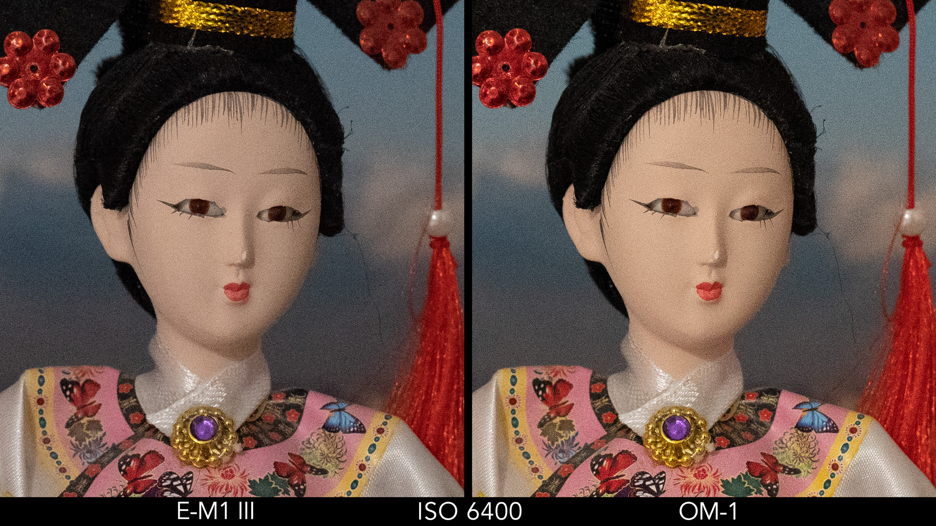 side by side image of a Japanese doll comparing ISO 6400 for the E-M1 III and OM-1