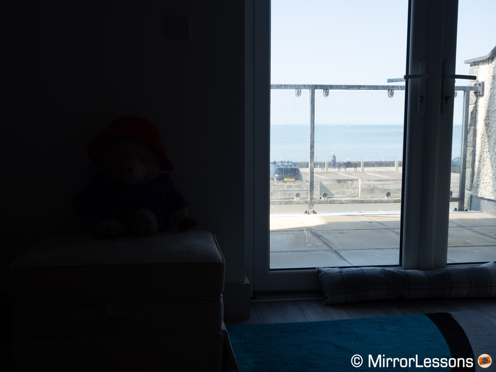 balcony and seaside from inside a living room