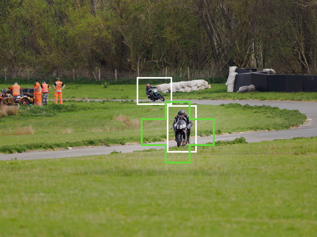 Motorbike racer on a track in the distance, with bright and green frames showing bird detection and the Target setting