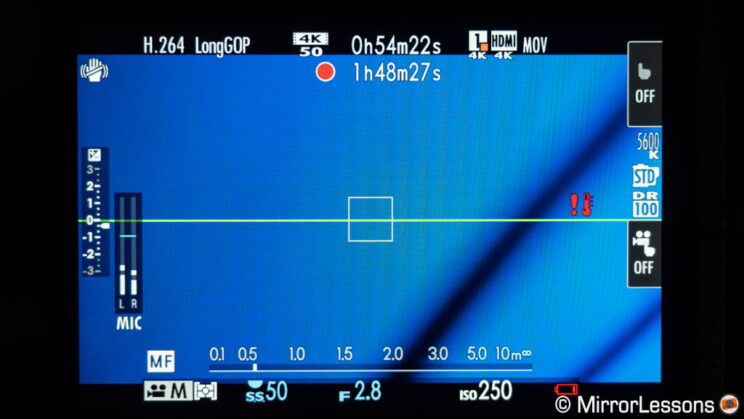 LCD screen of the Fuji X-H2S, showing nearly two hours recording and the overheat symbol.