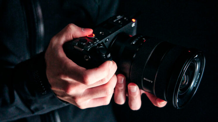 Hands holding the FX3 while recording