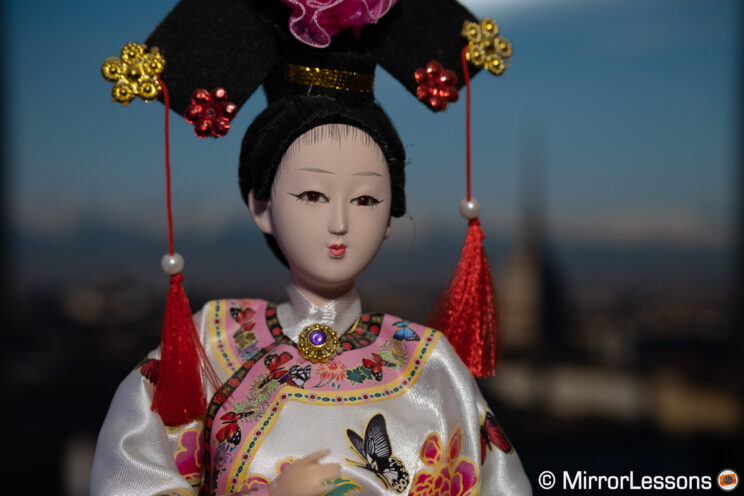 Japanese doll with cityscape background