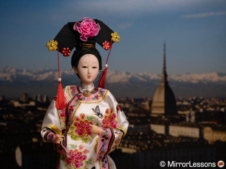 Japanese doll on urban background